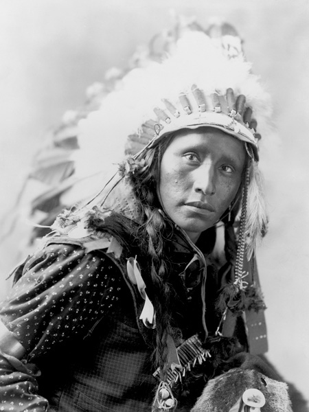obra Indian wearing White War Bonnet, 1900